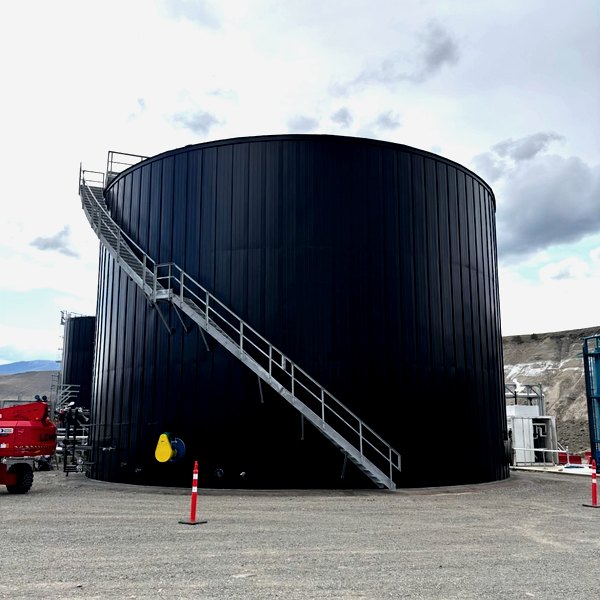 Pre-fabricated standing-seam tank panel system installed on an industrial storage tank