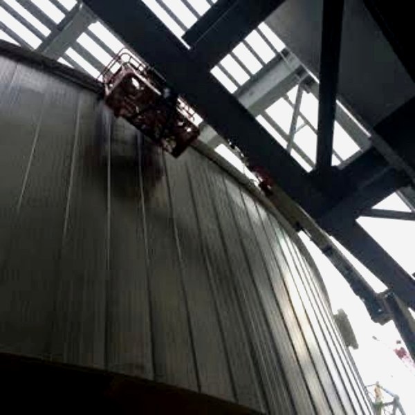 Double-lock standing-seam detail on a finished insulated tank panel