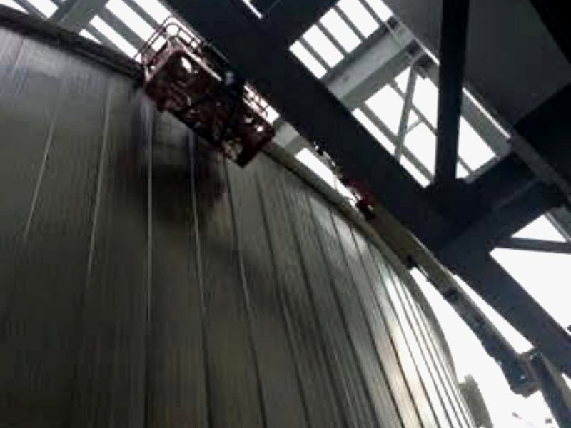 Standing-seam panel detail on curved tank surface