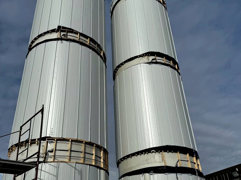 Twin insulated tower vessels at industrial site