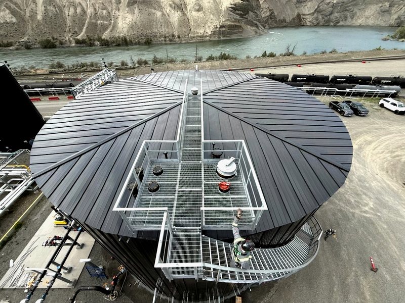 Aerial cone roof with standing-seam pattern over river canyon
