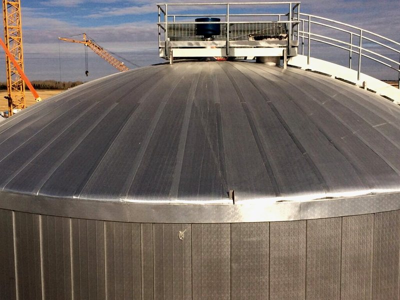 Large insulated tank with structural supports and walkway